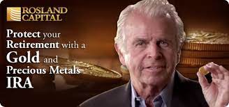 A man holding a gold bar, symbolizing the precious metals offered by Rosland Capital